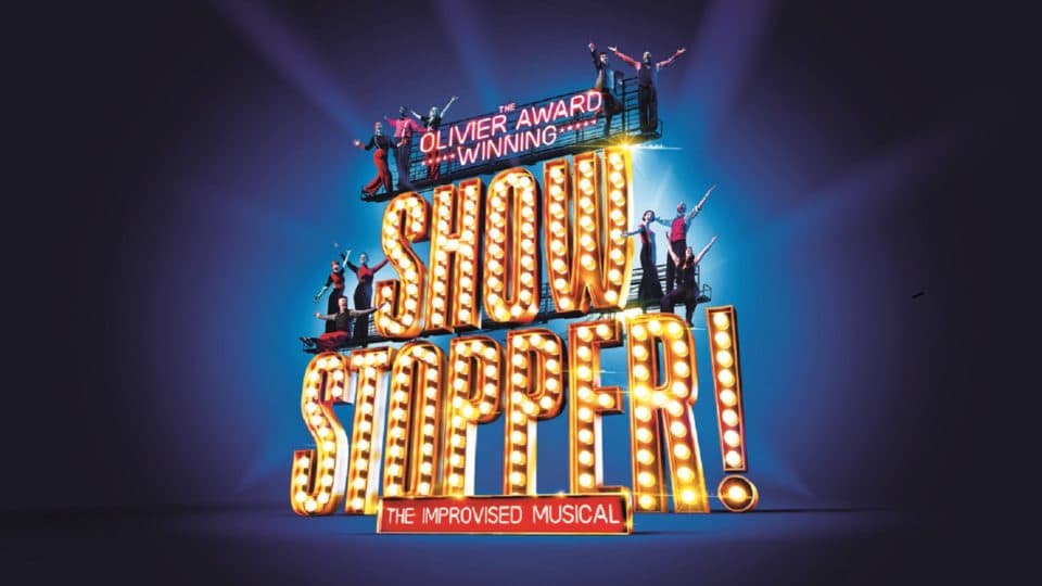 The Showstoppers logo appears in glitzy text with performers standing atop it