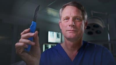 Dr Richard Shepherd with a scalpel
