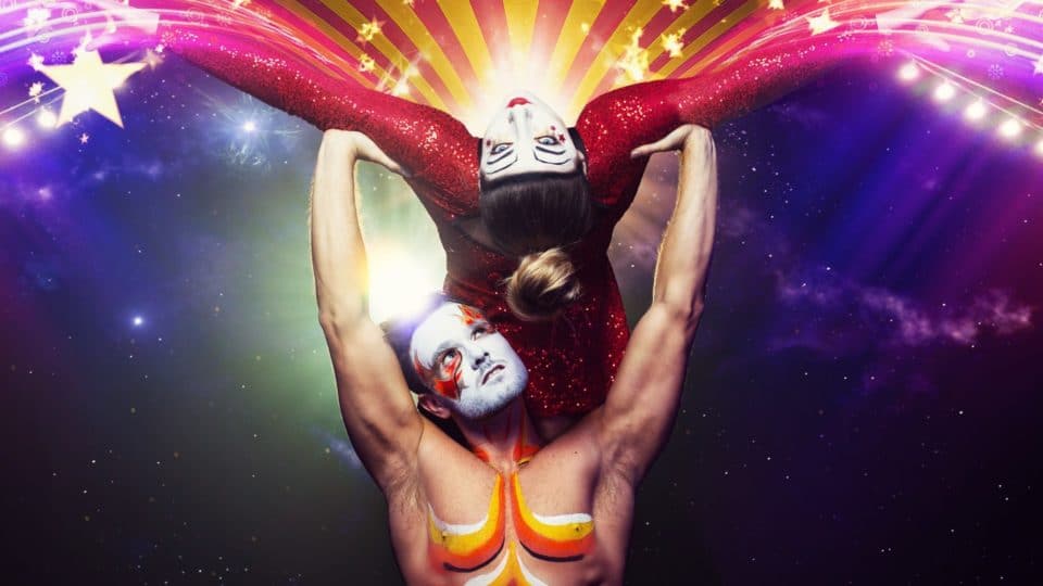 Two acrobats in a colourful show poster for Cirque
