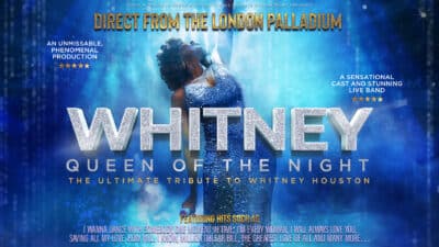 Whitney title text with performer behind in front of blue curtain and lit stage