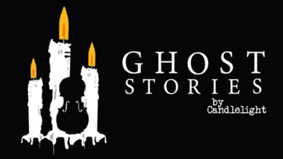 Ghost Stories text with burning candles in the shape of a violin